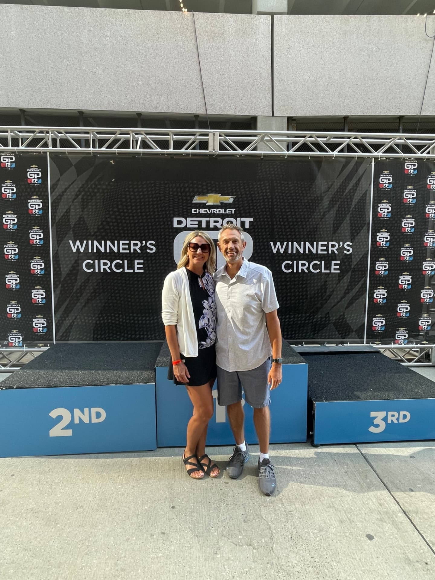 Enjoying the Detroit Grand Prix with her husband, Kris. The two met at a racetrack and both come from racing families.
