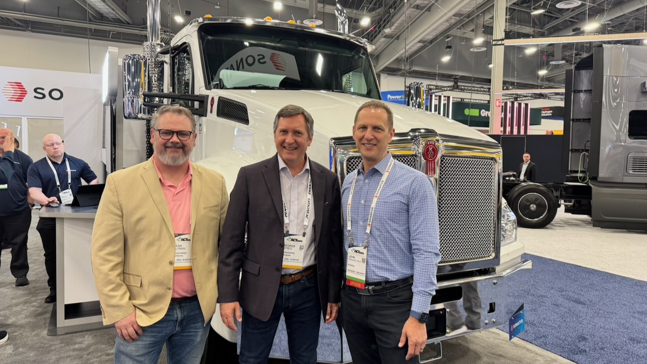 With John Heinlein, Ph.D., Chief Marketing Officer at  Sonatus in front of a software-defined truck at ACT Expo.