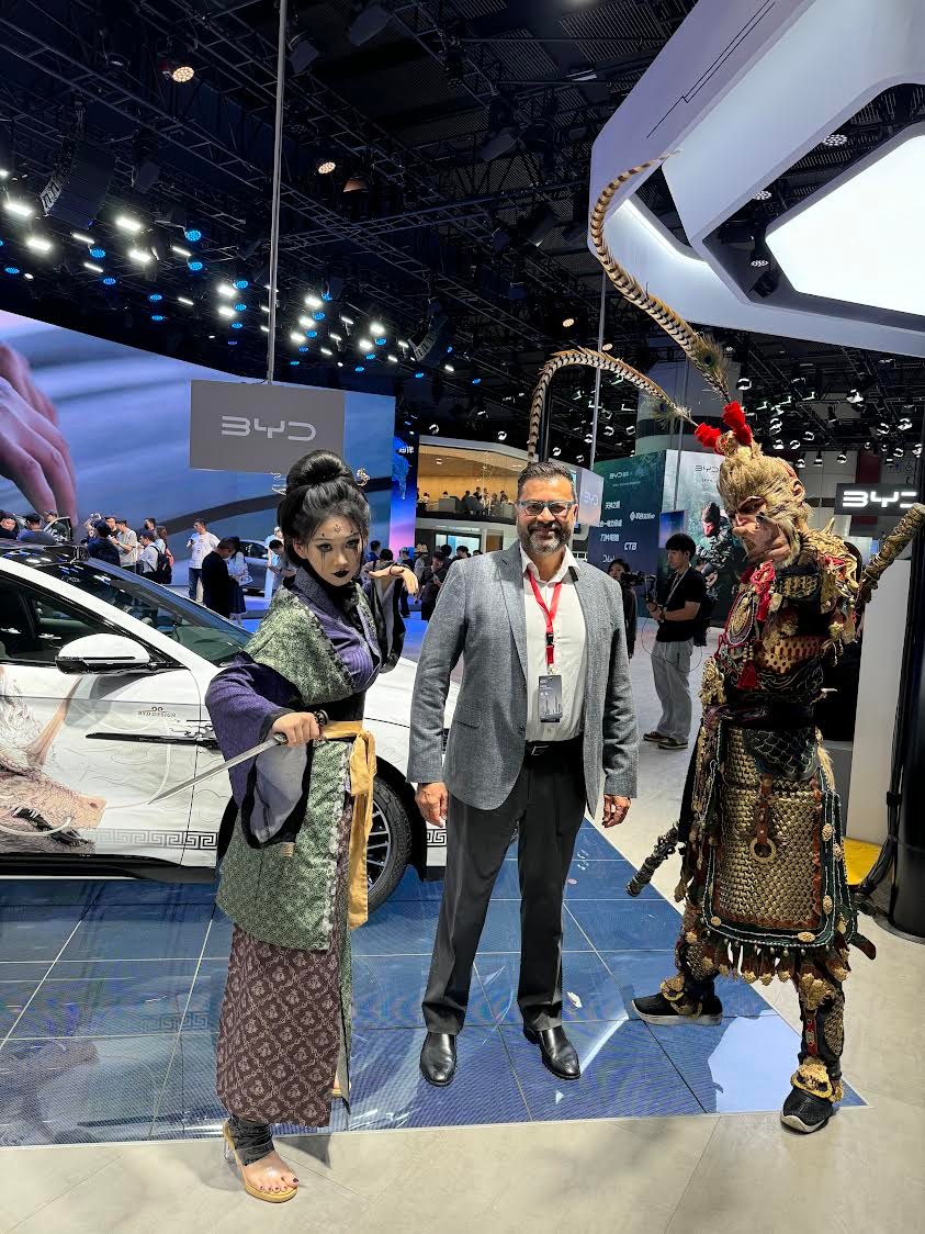 Posing with Black Myth: Wukong characters in the BYD booth at the Guangzhou Auto Show (2024).