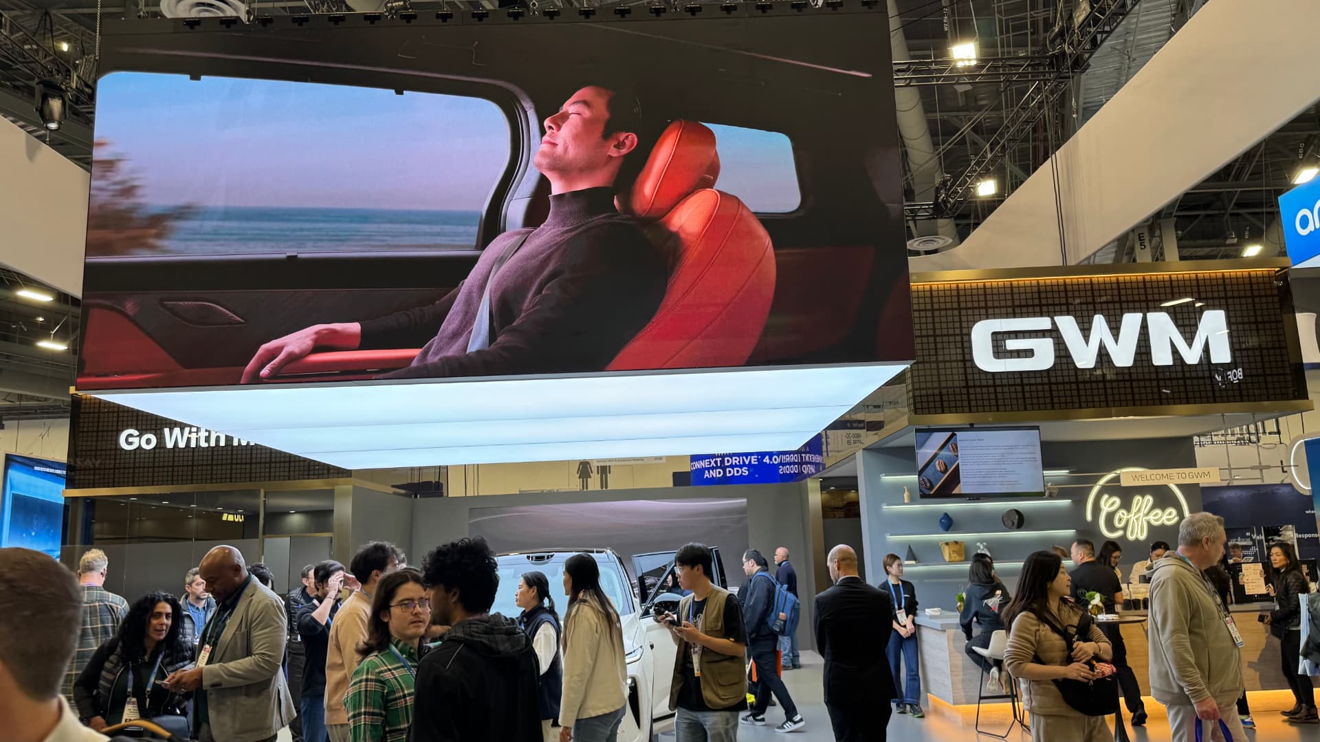 GWM’s stand at CES 2026, with a large screen showing hands-free driving