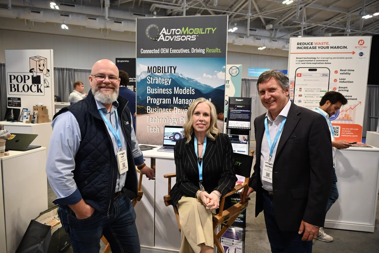 AutoMobility Advisors team at an industry event booth