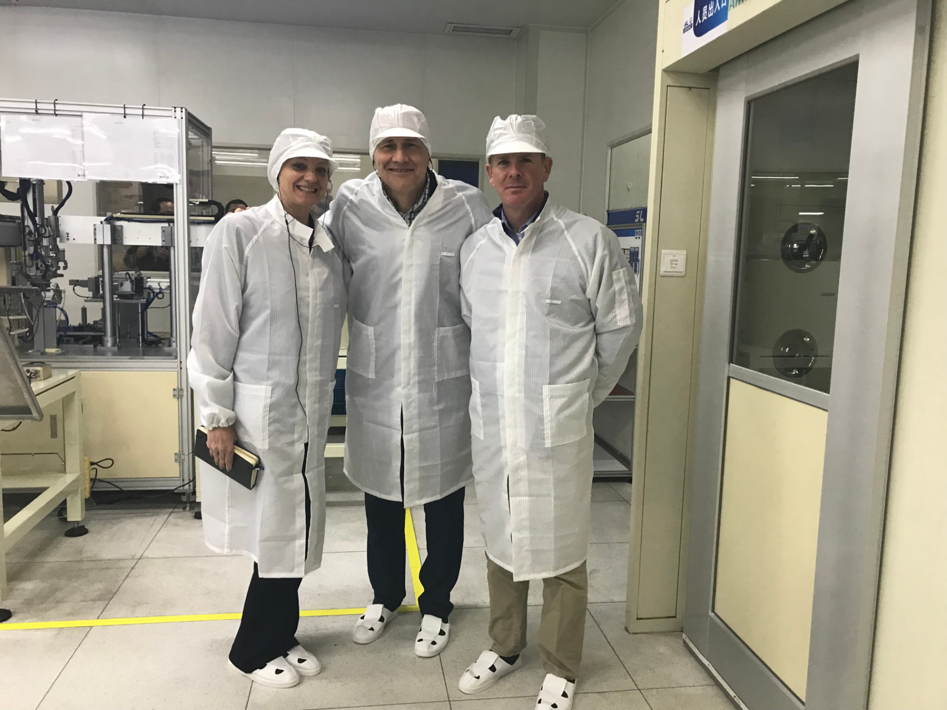 Visiting a supplier in China, preparing with the team to enter a clean room.
