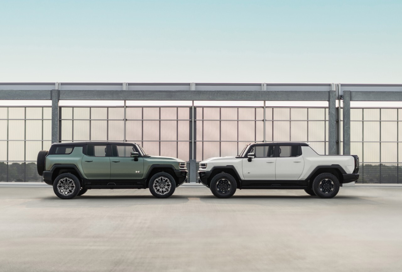 2024 GMC HUMMER EV Edition 1 SUV in Moonshot Green Matte and 2023 GMC HUMMER EV Edition 1 Pickup in Interstellar White