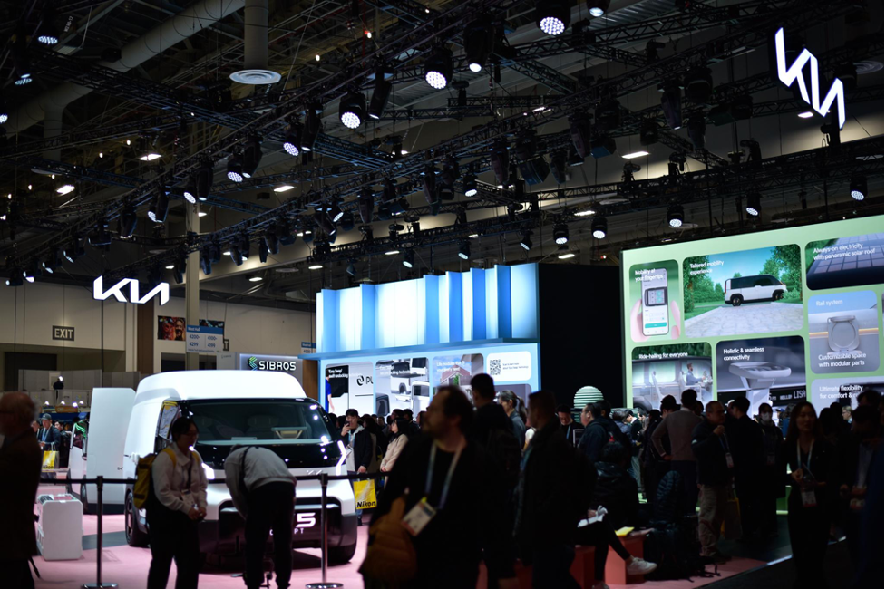 Kia’s booth featuring PBV EV van demos. Photo by Mariestella