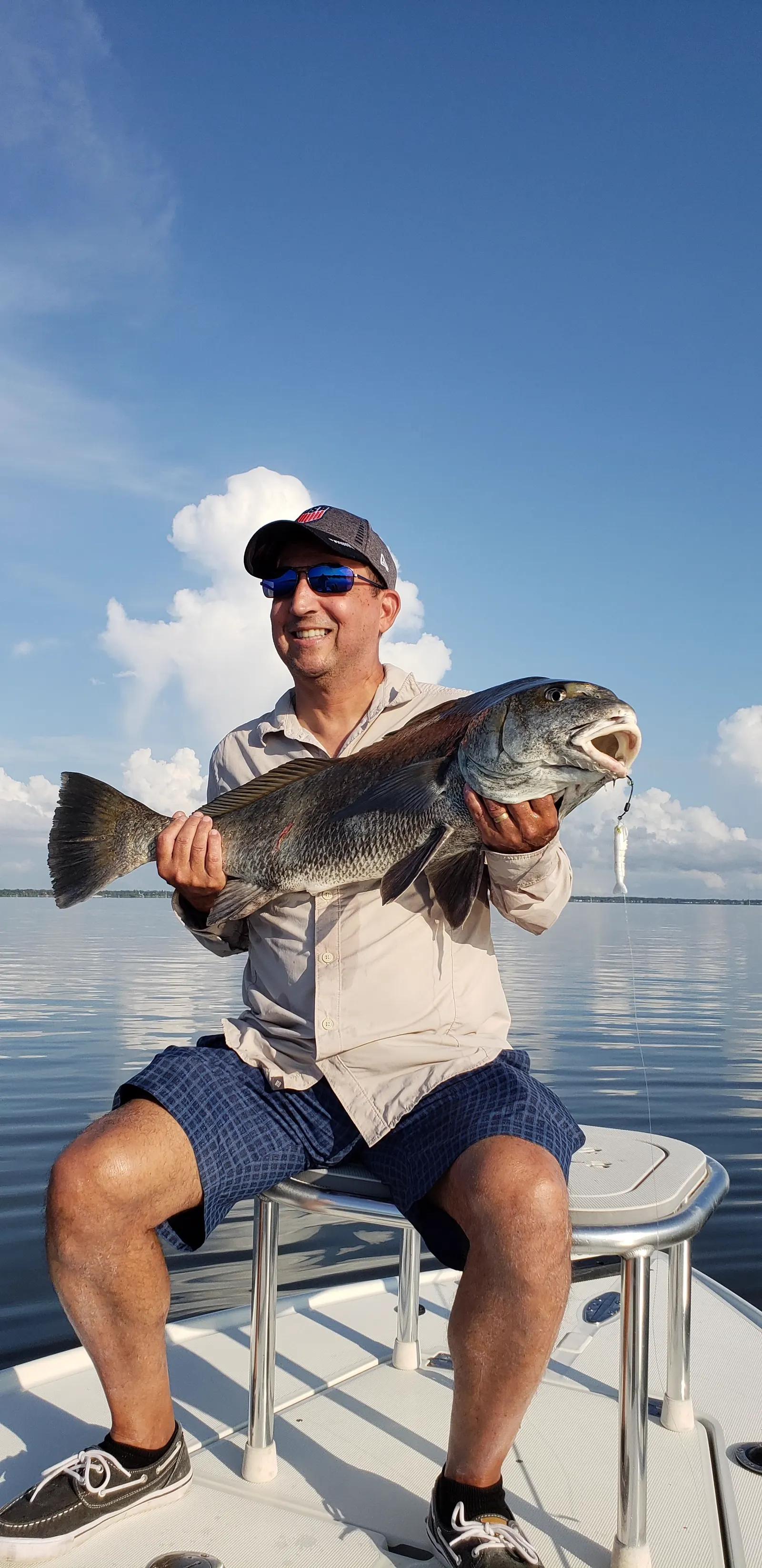 Catching my breath after reeling in a 25 lb. Black Drum near my home in Florida.