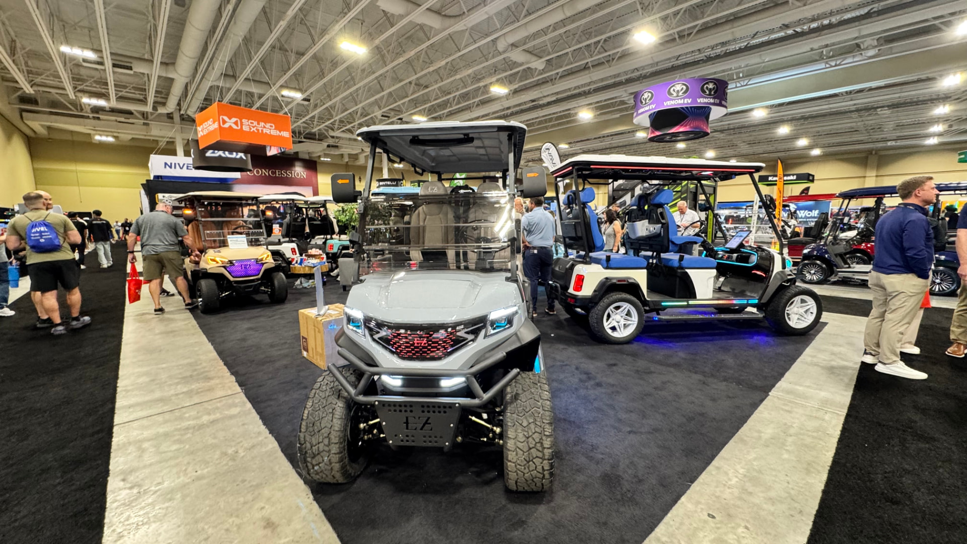 Customized golf carts and LSVs with LED lighting on the GolfCarting Expo floor