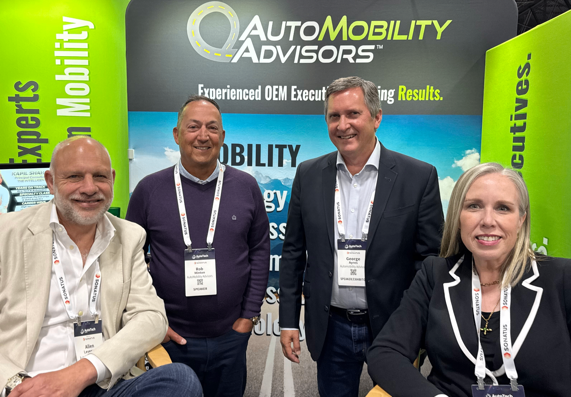 AutoMobility Advisors executives Allen Levenson, Rob Minton, George Ayres, and Denise Barfuss at their AutoTech booth.